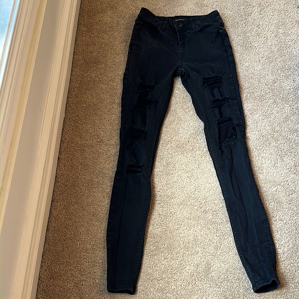 Black Heart skinny jeans with built in fishnets, size 0.
